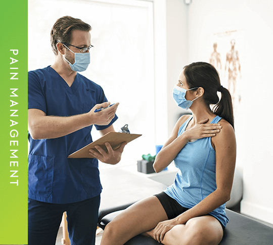Doctor examining woman's shoulder